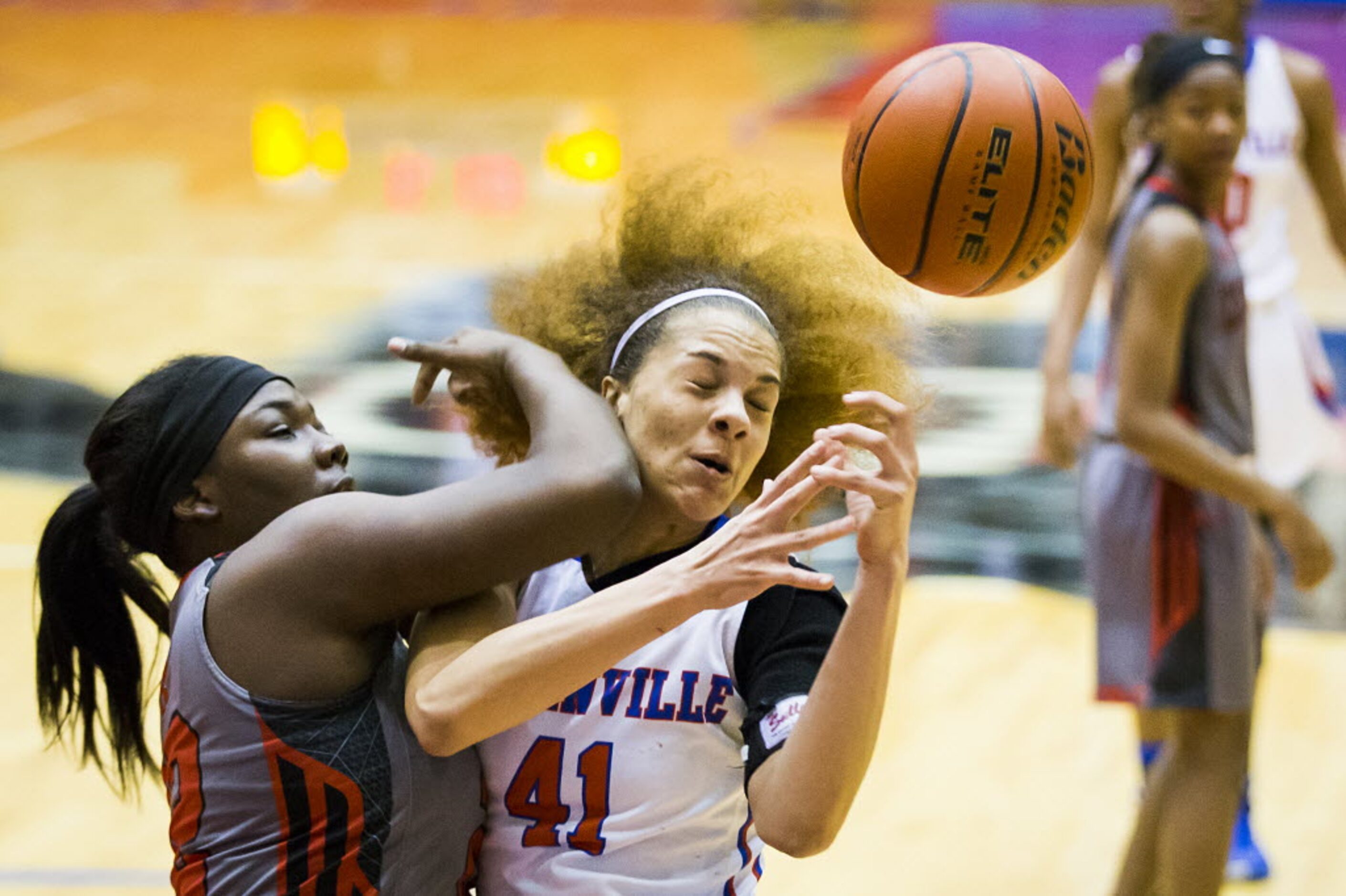 Duncanville forward Madison Townley (41) fights for a rebound against Cedar Hill forward...