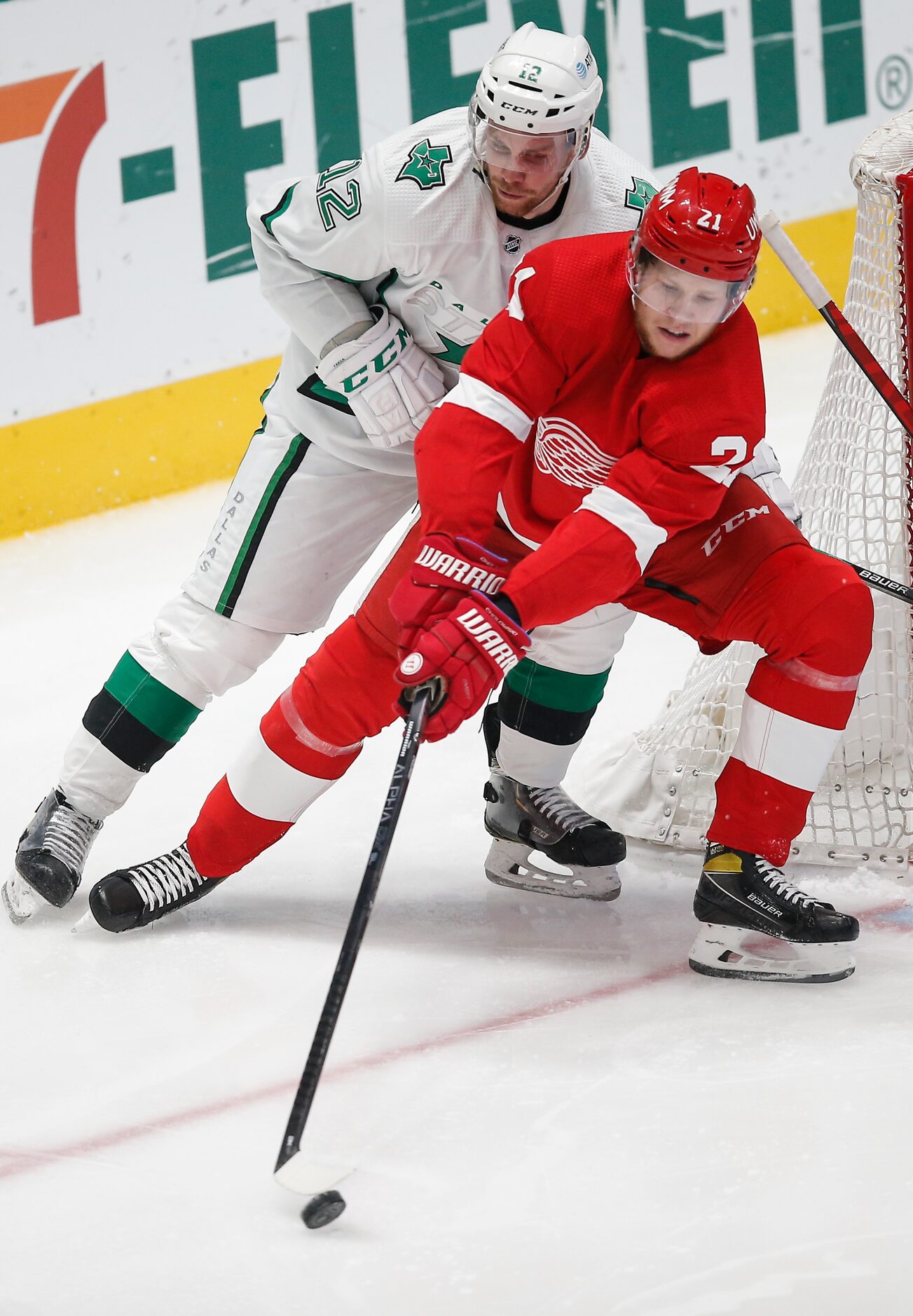 Dallas Stars forward Radek Faksa (12) and Detroit Red Wings defenseman Dennis Cholowski (21)...