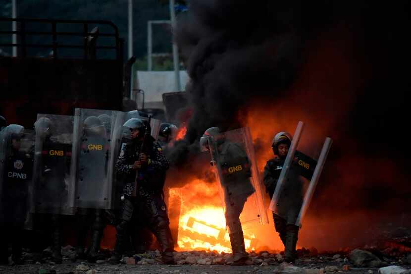 Venezuelan security forces clash with supporters of Venezuelan opposition leader Juan Guaido...