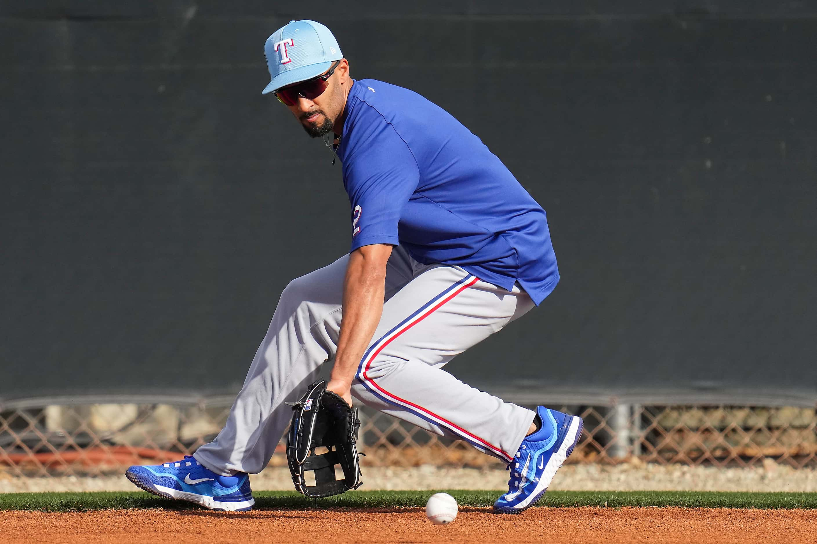 Texas Rangers infielder Marcus Semien participates in a fielding drill during a spring...