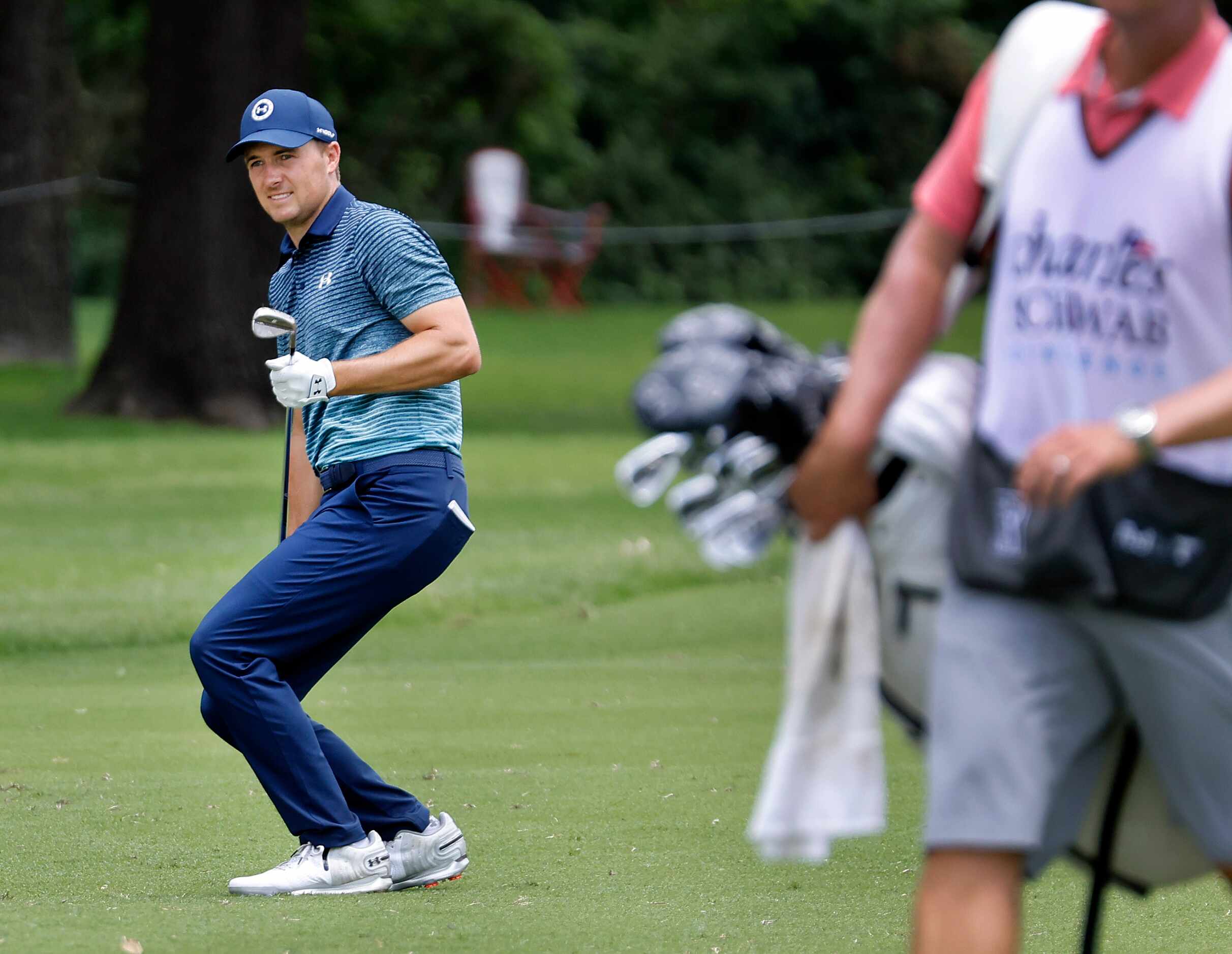 Professional golfer Jordan Spieth reacts as his ball settles a couple feet short of the No....