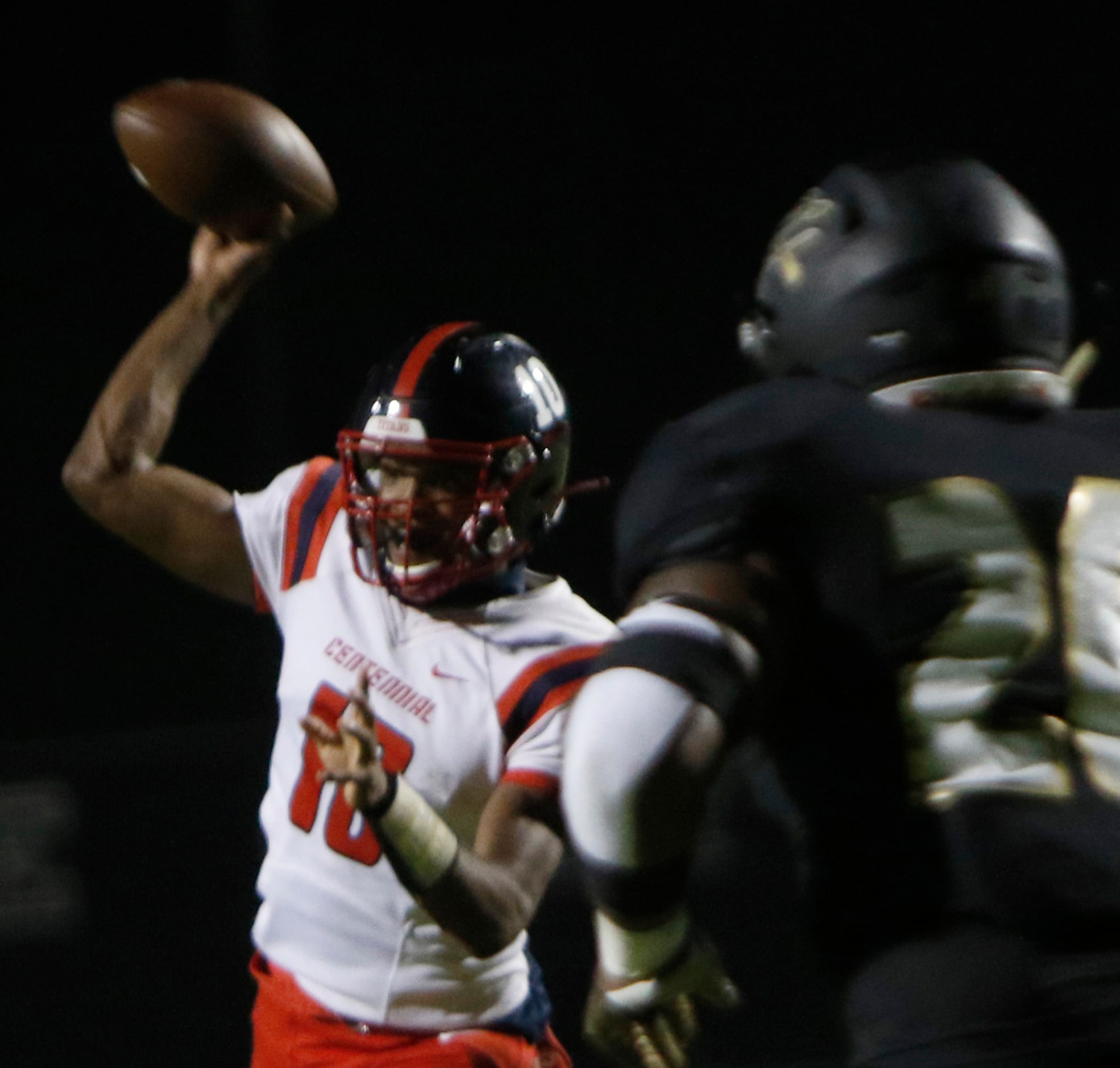 Frisco Centennial quarterback Grayson Dairies (10) launches a pass toward the end zone...