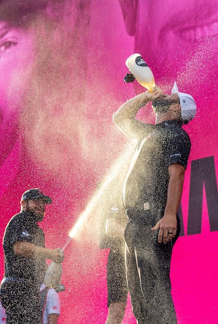 First-place team champions, Tyrrell Hatton, left, of Legion XIII, and captain Jon Rahm,...