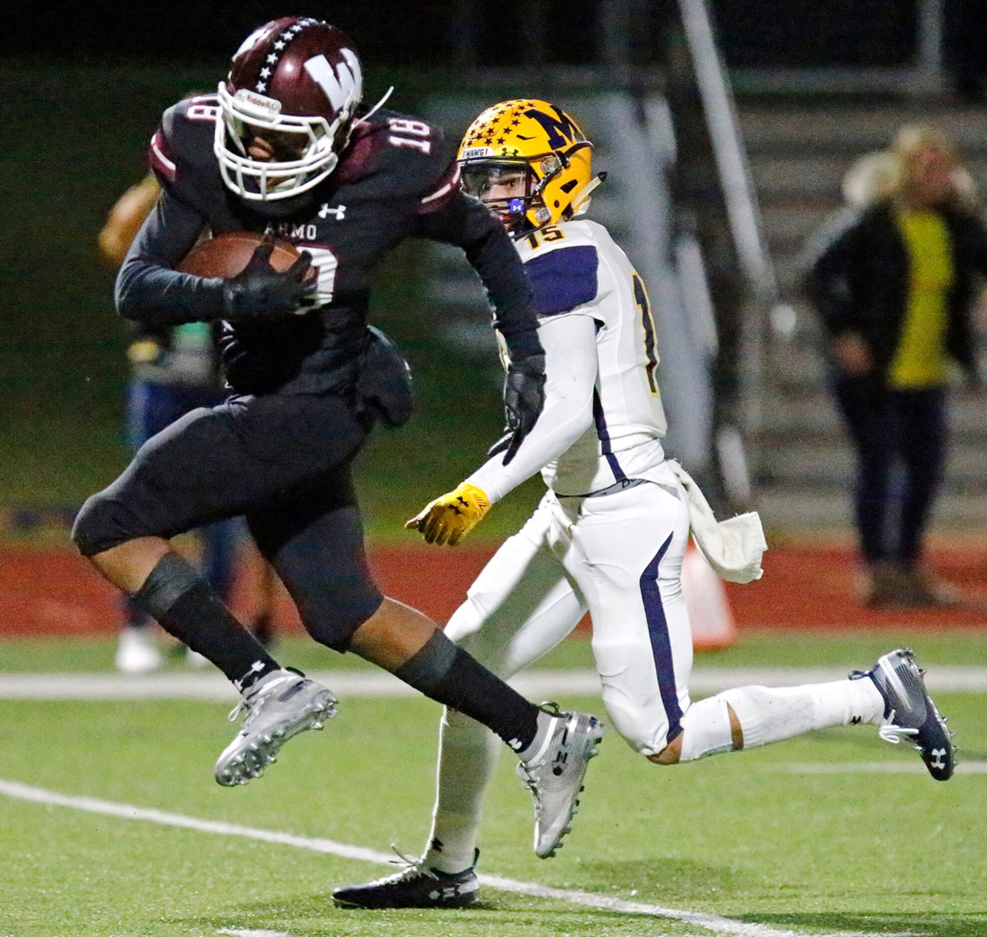 Wylie High School wide receiver Malik Ford (18) heads for the end zone past McKinney High...