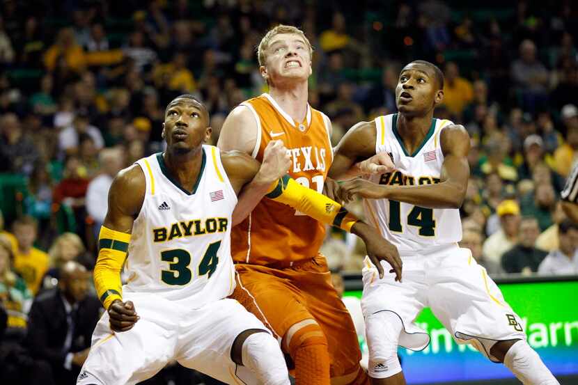 Texas Longhorns forward Connor Lammert (21) is blocked out in the lane on a free throw by...