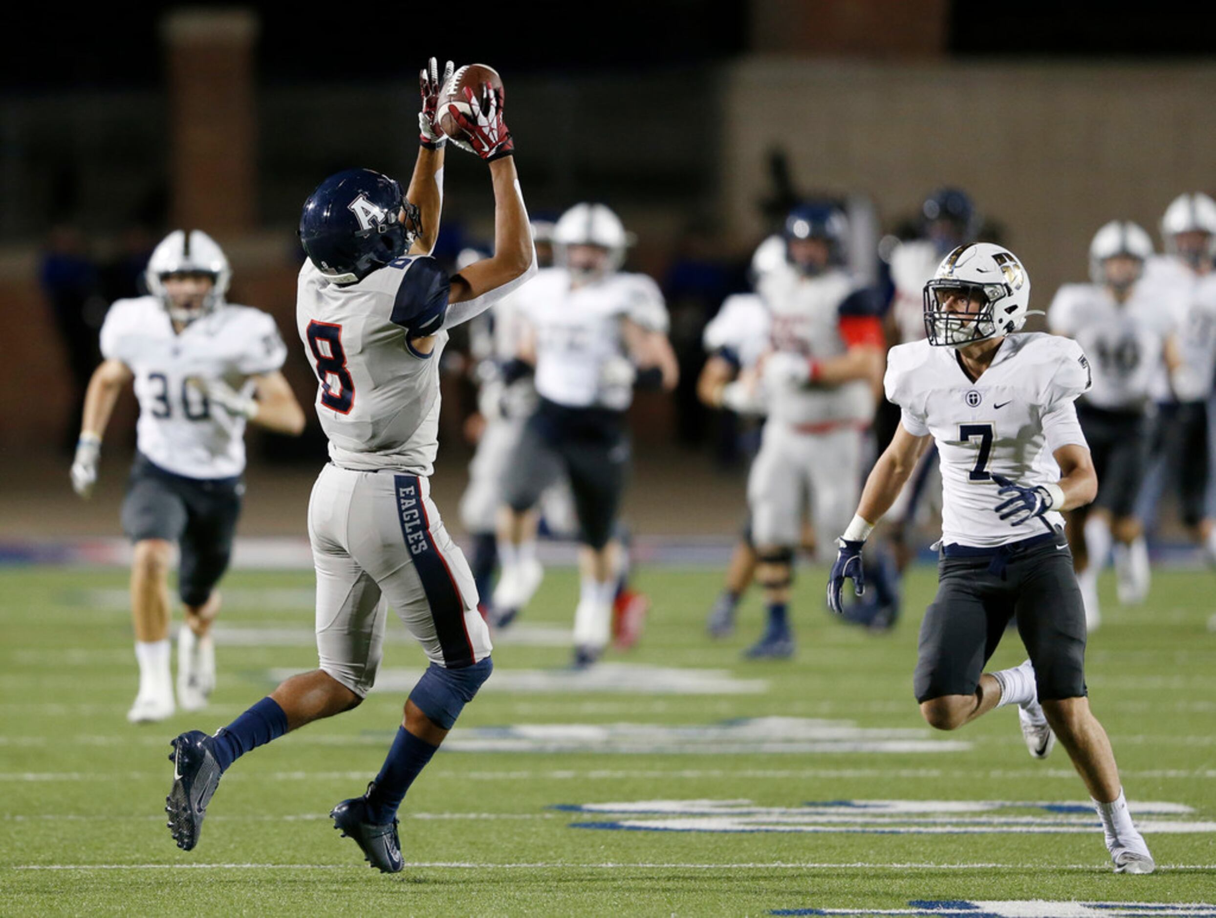 Allen's Blaine Green (8) catches a pass in front of Jesuit's Chase Walker (7) during the...