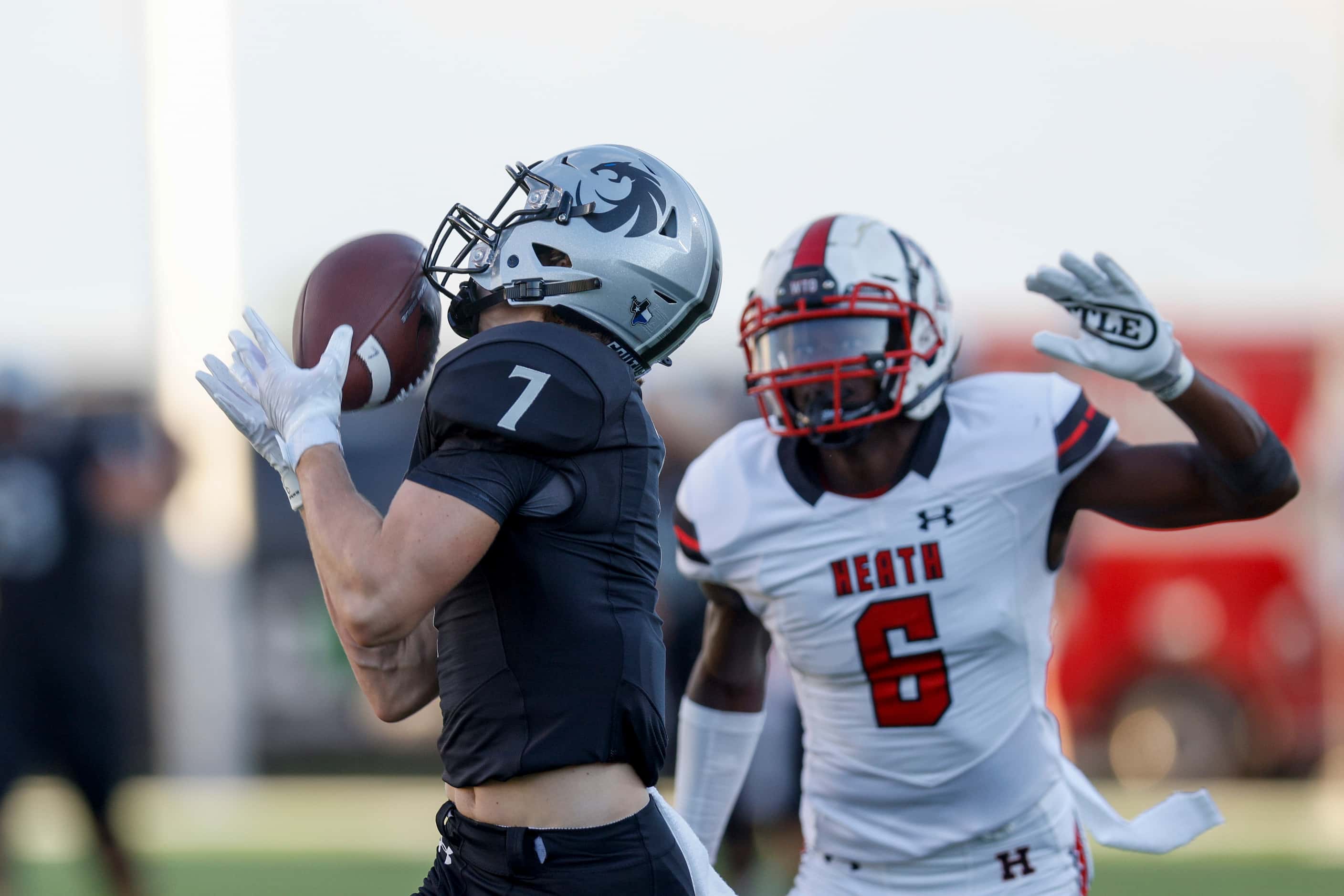 Denton Guyer wide receiver Landon Sides (7) catches a pass for a touchdown ahead of...