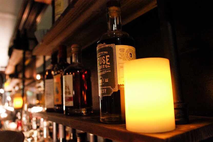 Liquor on the wall behind the bar at Revelers Hall in Bishop Arts neighborhood in Dallas on...