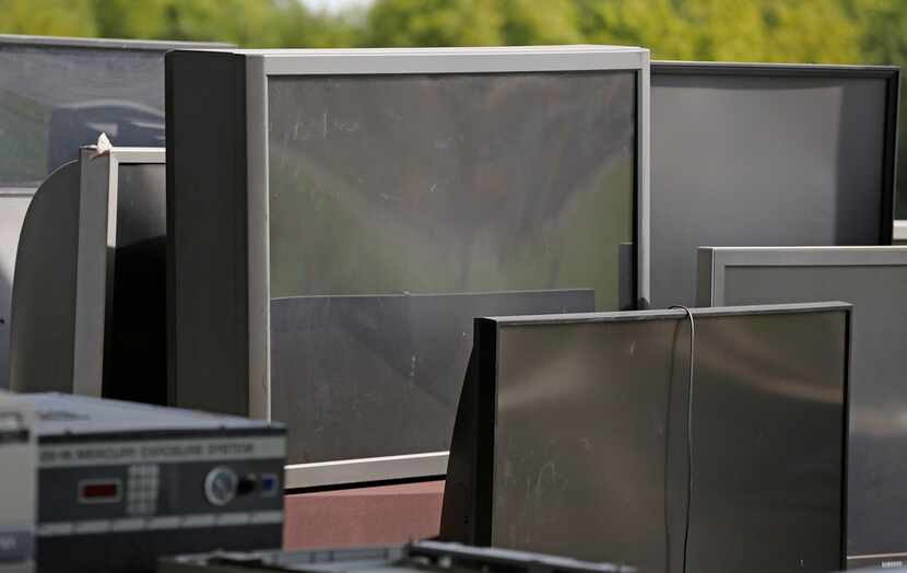 Old televisions sit in the recycle area of the McCommas Bluff Landfill at 5100 Youngblood...