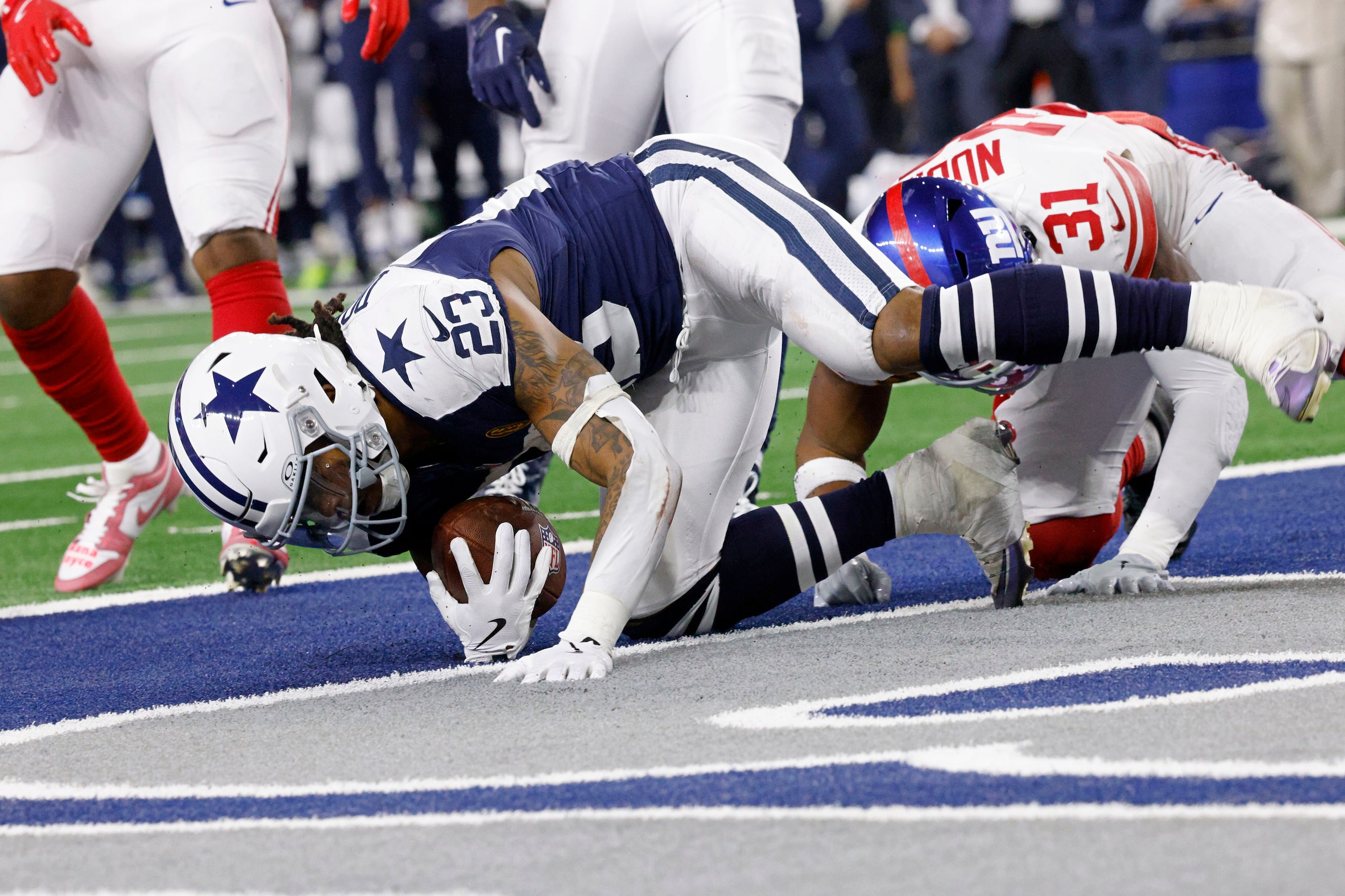 Dallas Cowboys running back Rico Dowdle (23) scores a touchdown over New York Giants safety...