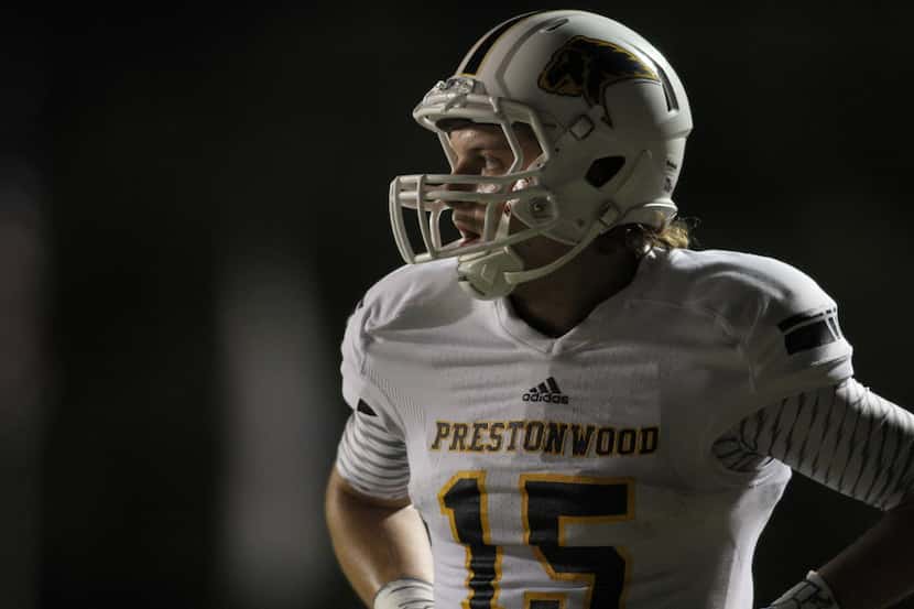 Prestonwood receiver Jonathan Heasley (15) pauses to catch his breath following his long...