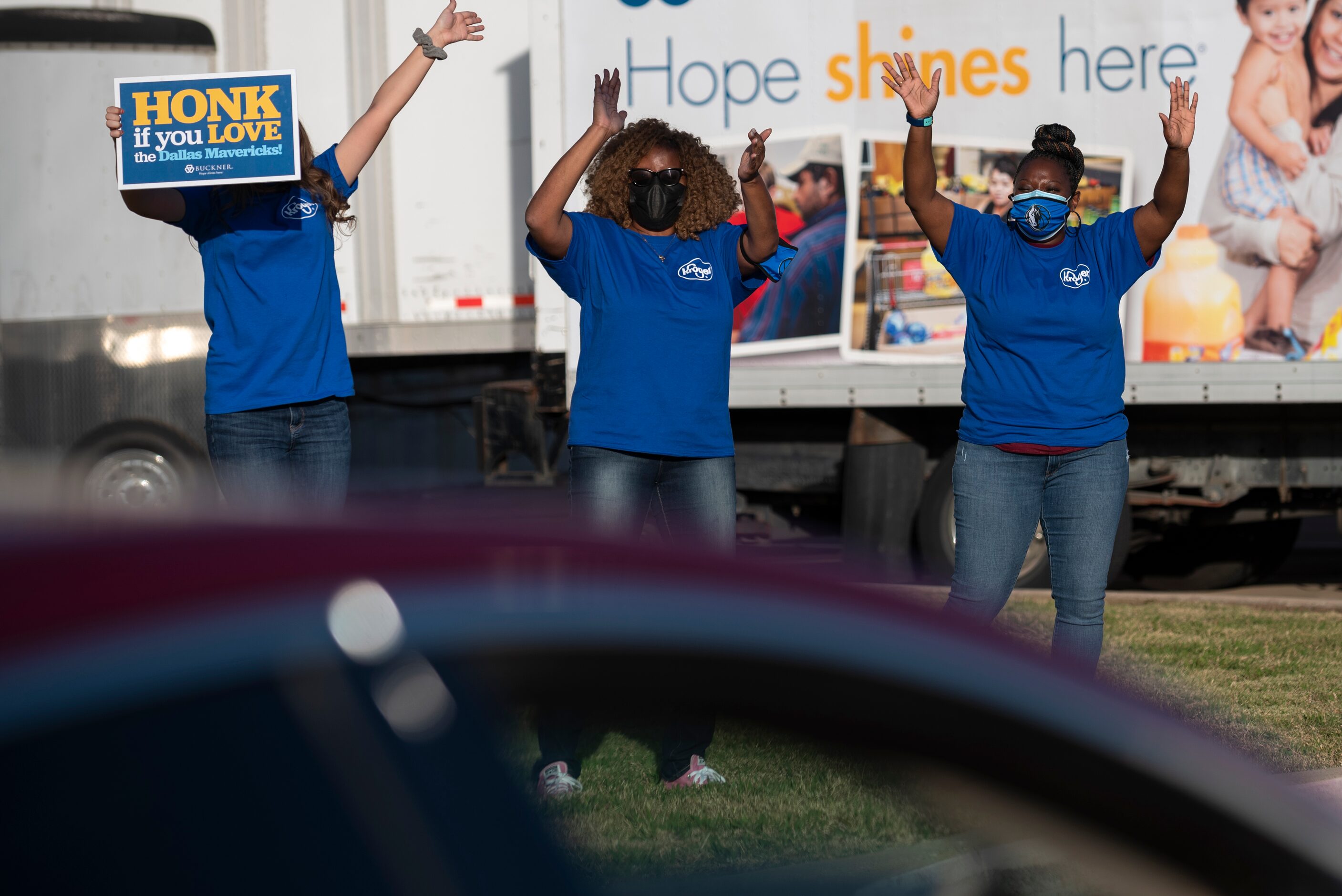 Volunteer Lauryn Spurrier, left, Kroger employees Marva Pate, center, and Ericka Lewis,...