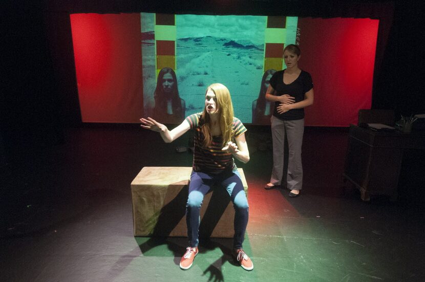 Cara L. Reid, front, and Whitney Holotik perform a scene from "mani/gift" at the Bath House...