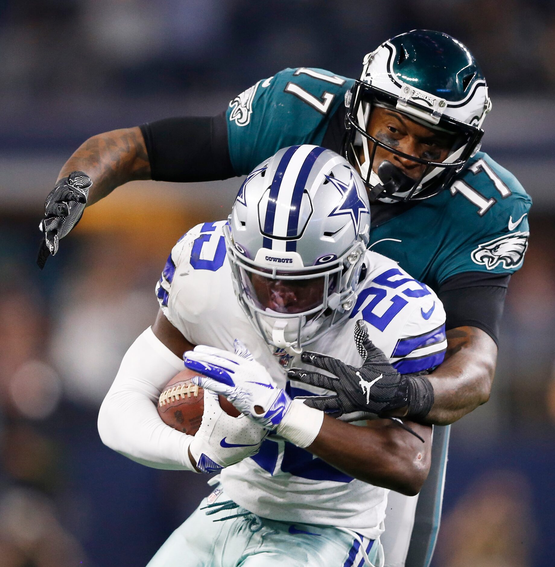 Dallas Cowboys free safety Xavier Woods (25) is tackled by Philadelphia Eagles wide receiver...