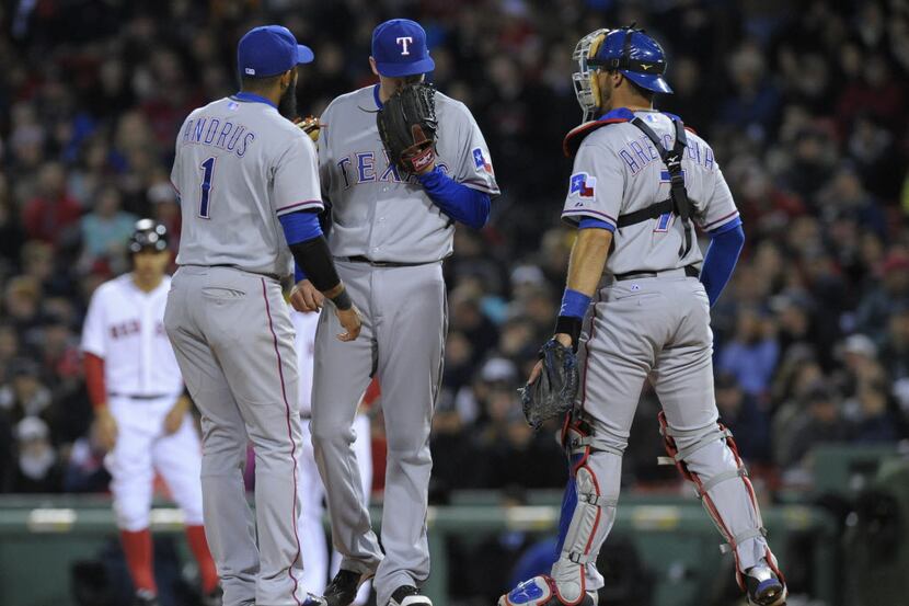 Apr 7, 2014; Boston, MA, USA; Texas Rangers shortstop Elvis Andrus (1) and catcher J.P....