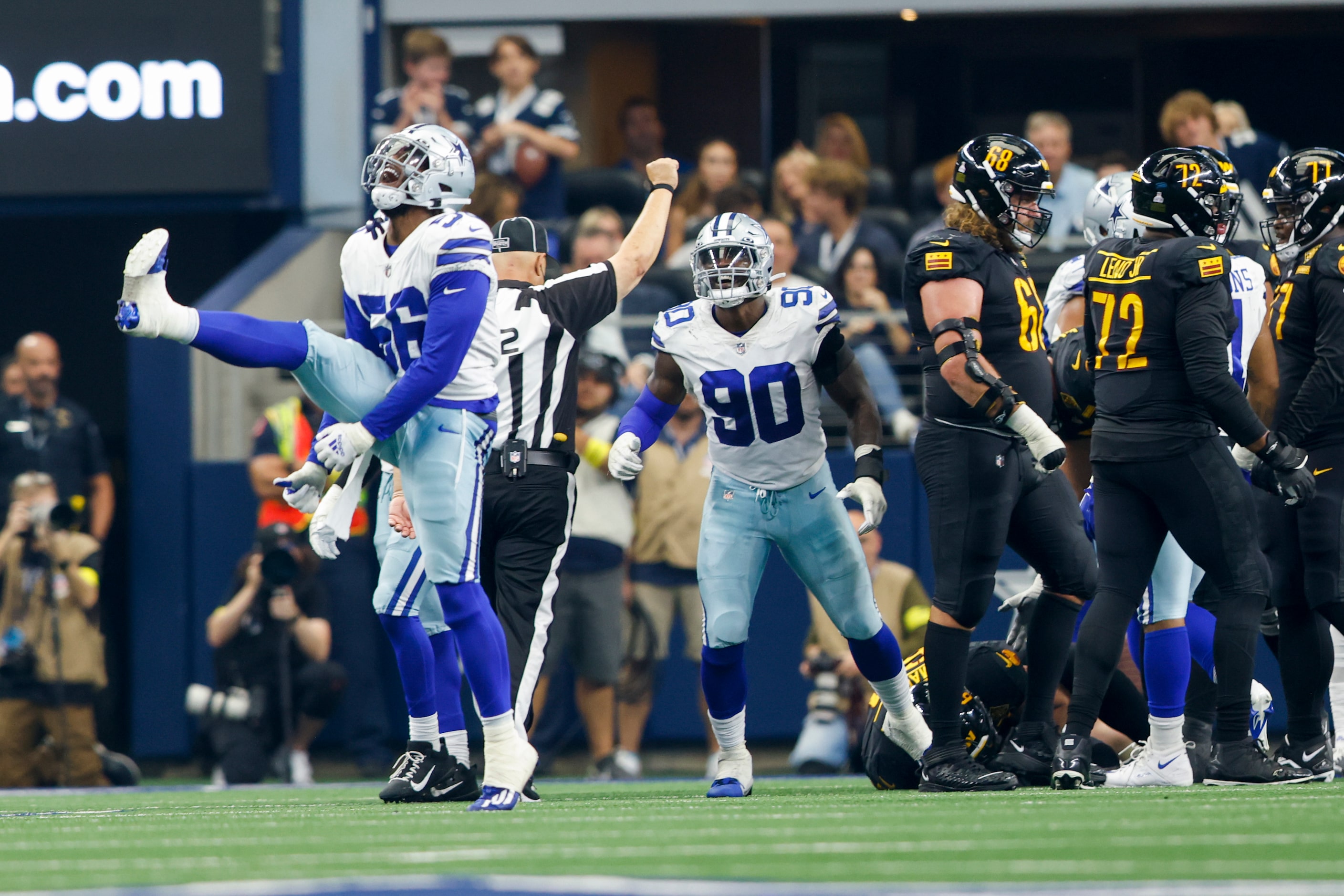 Dallas Cowboys defensive end Dante Fowler Jr. (56) and Dallas Cowboys defensive end DeMarcus...