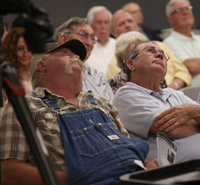 Concerned citizens watched an overhead screen of live proceedings during the Region C...