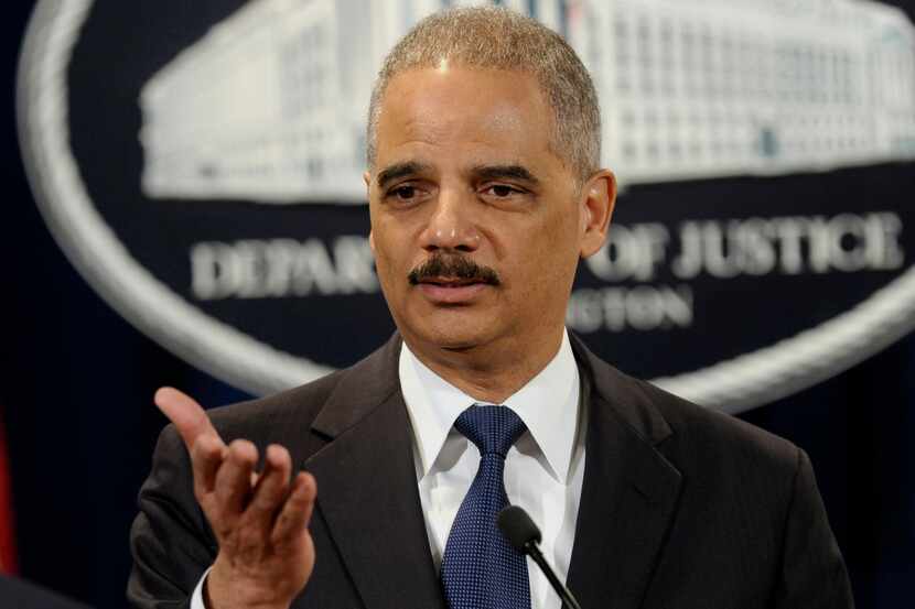 Attorney General Eric Holder announces a $1.2 billion settlement with Toyota over its...