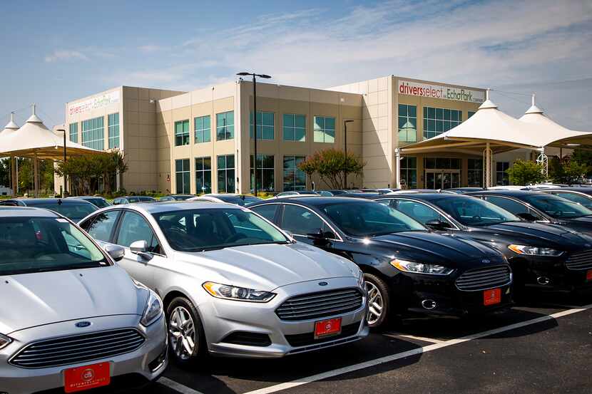 Rows of used cars for sale are shown in this 2018 file photo at Driversselect, now called...