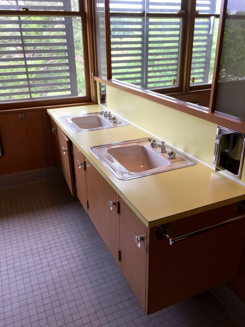 Original twin sinks and built-in cabinetry in an upstairs bathroom at the O'Neil...