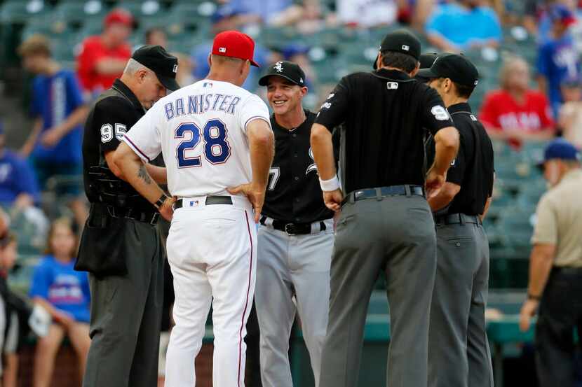 Chicago White Sox Manager Rick Renteria and Texas Rangers Manager Jeff Banister meet with...
