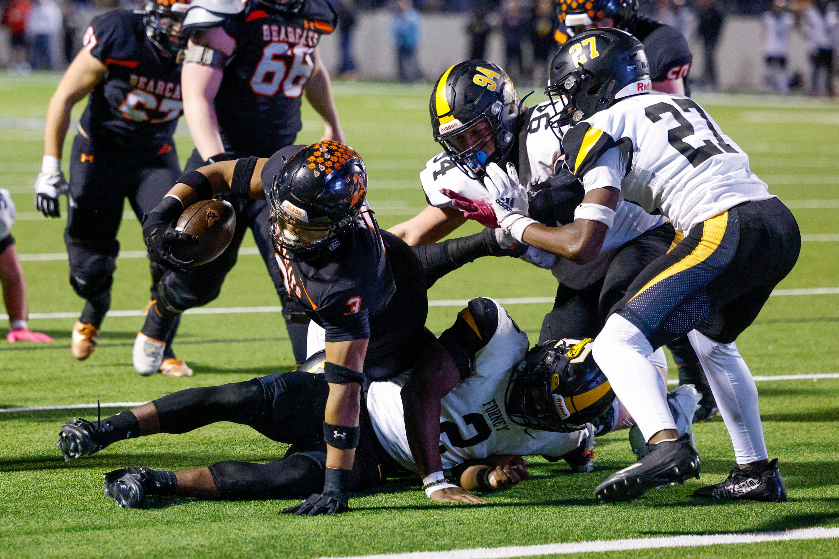 Forney linebacker Kelvion Riggins (2) tackles Aledo running back Davhon Keys (3) short of...