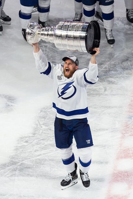 Blake Coleman (20) of the Tampa Bay Lightning hoists the Stanley Cup after defeating the...