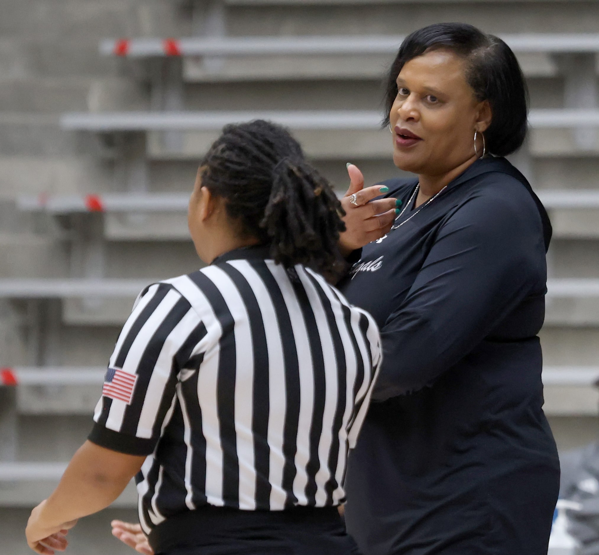 Denton Braswell head coach Lisa Williams questions the lack of a call with a game official...