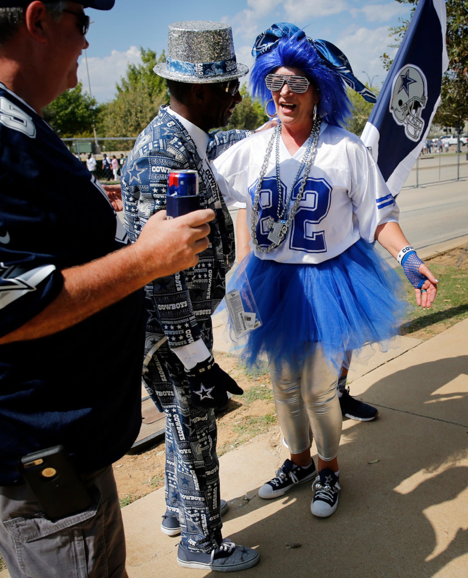 Dallas Cowboys fans James 'The Suitman 1' Wright  (center) and Karolyn Neuman of Navasota...