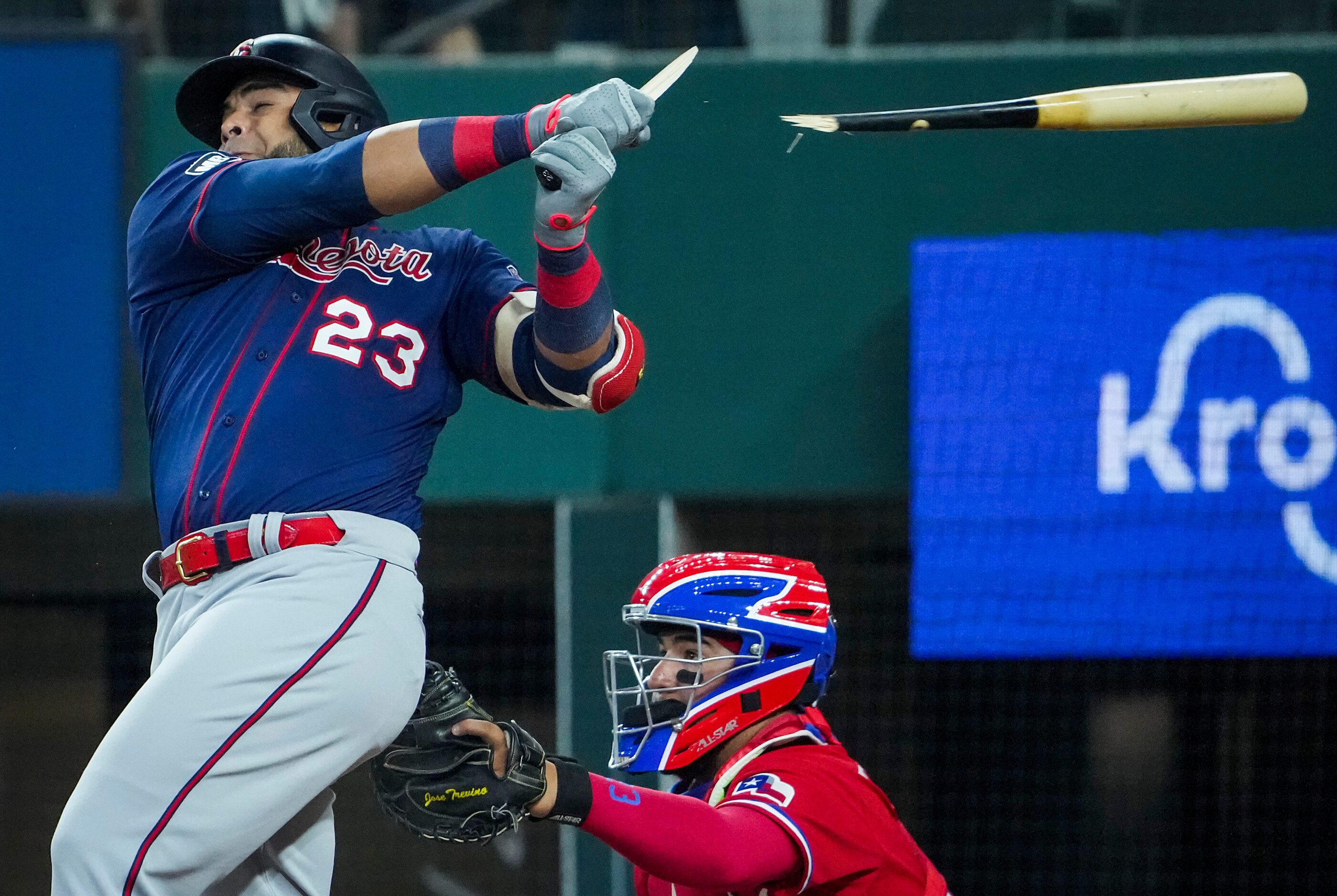 Minnesota Twins designated hitter Nelson Cruz  breaks his bat on an RBI single as Texas...