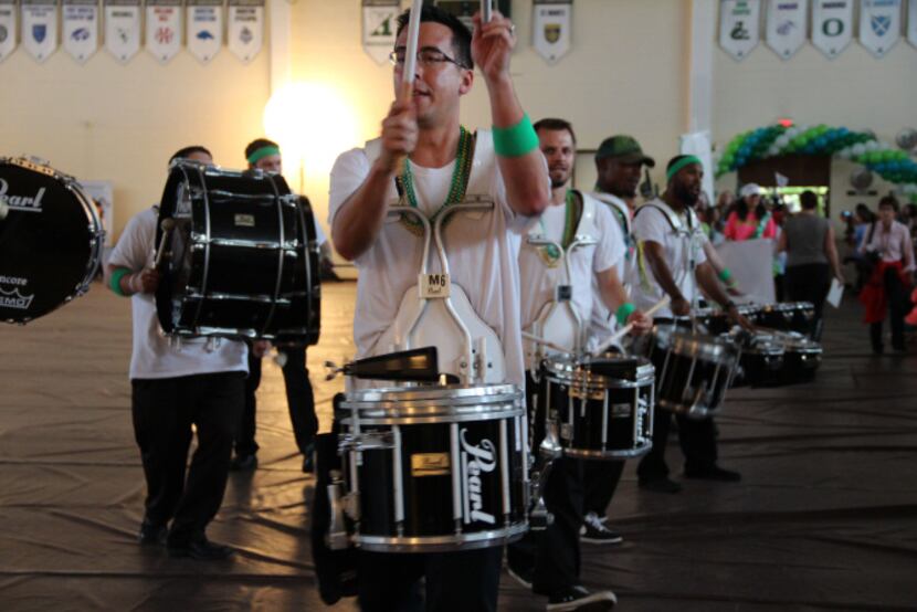 A drum line served as the prelude to the centennial parade Saturday night.