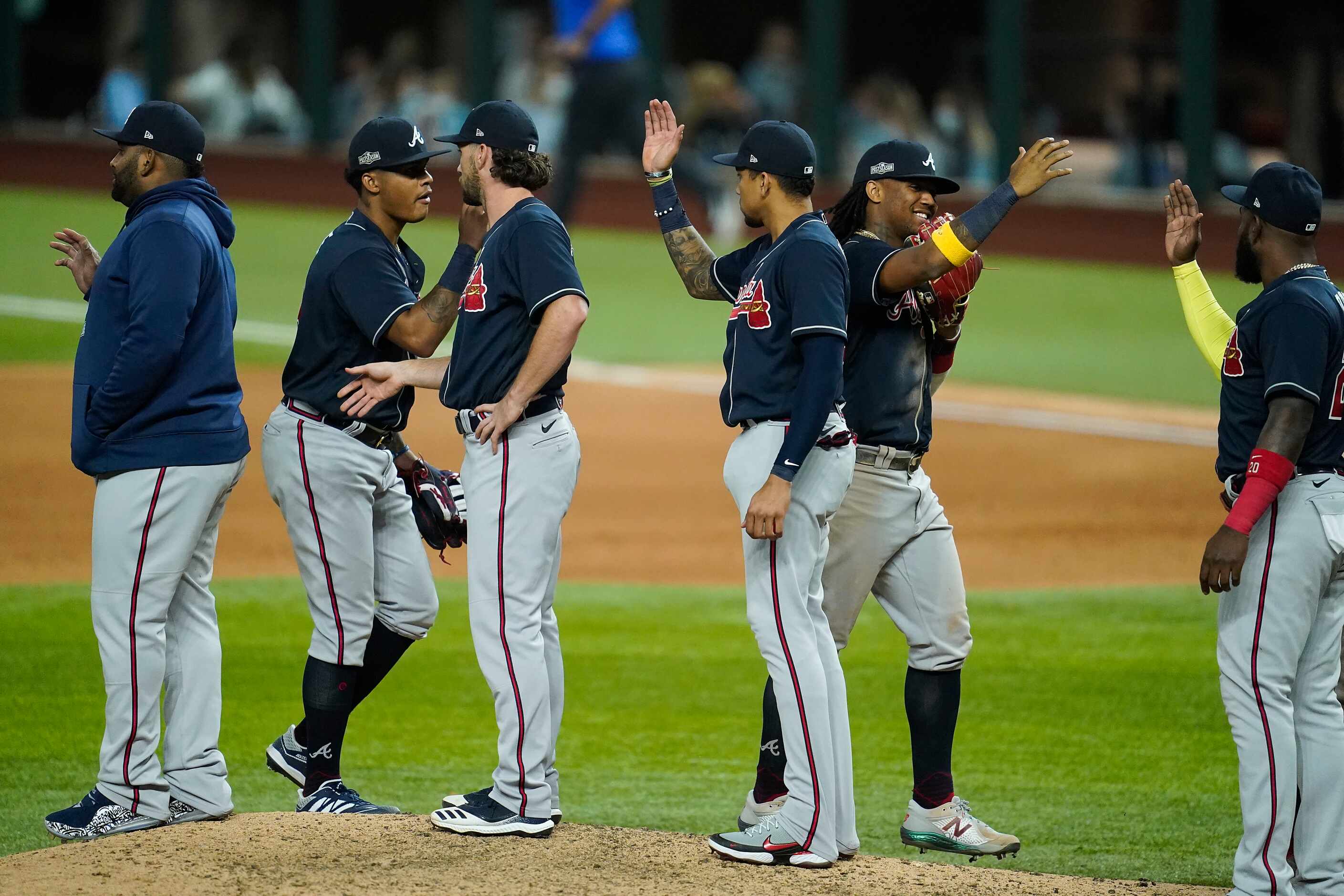 Atlanta Braves players celebrate a 8-7 victory over the Los Angeles Dodgers in Game 2 of a...