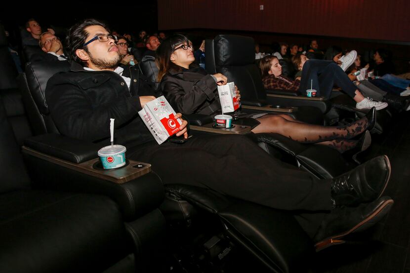 Gustavo Alvarado and Gemma Ortega recline in their seats at a party before the opening of...