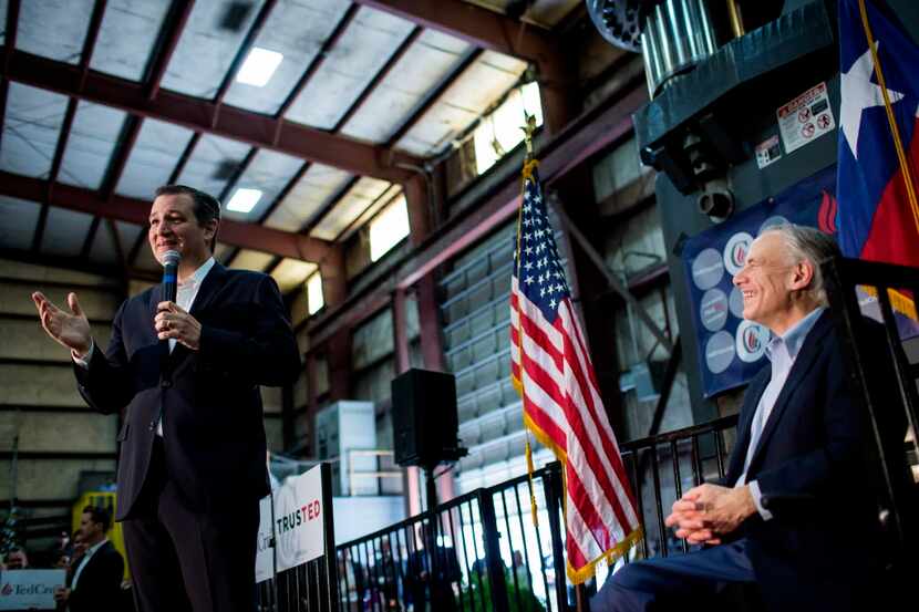 
Sen. Ted Cruz gets an assist from Gov. Greg Abbott during a campaign event in Houston. 
