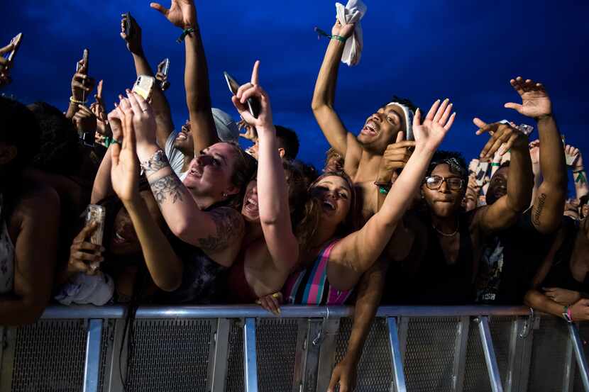 Festival goers get hype during Lil Wayne's performance at JMBLYA at Fair Park on May 3, 2019.