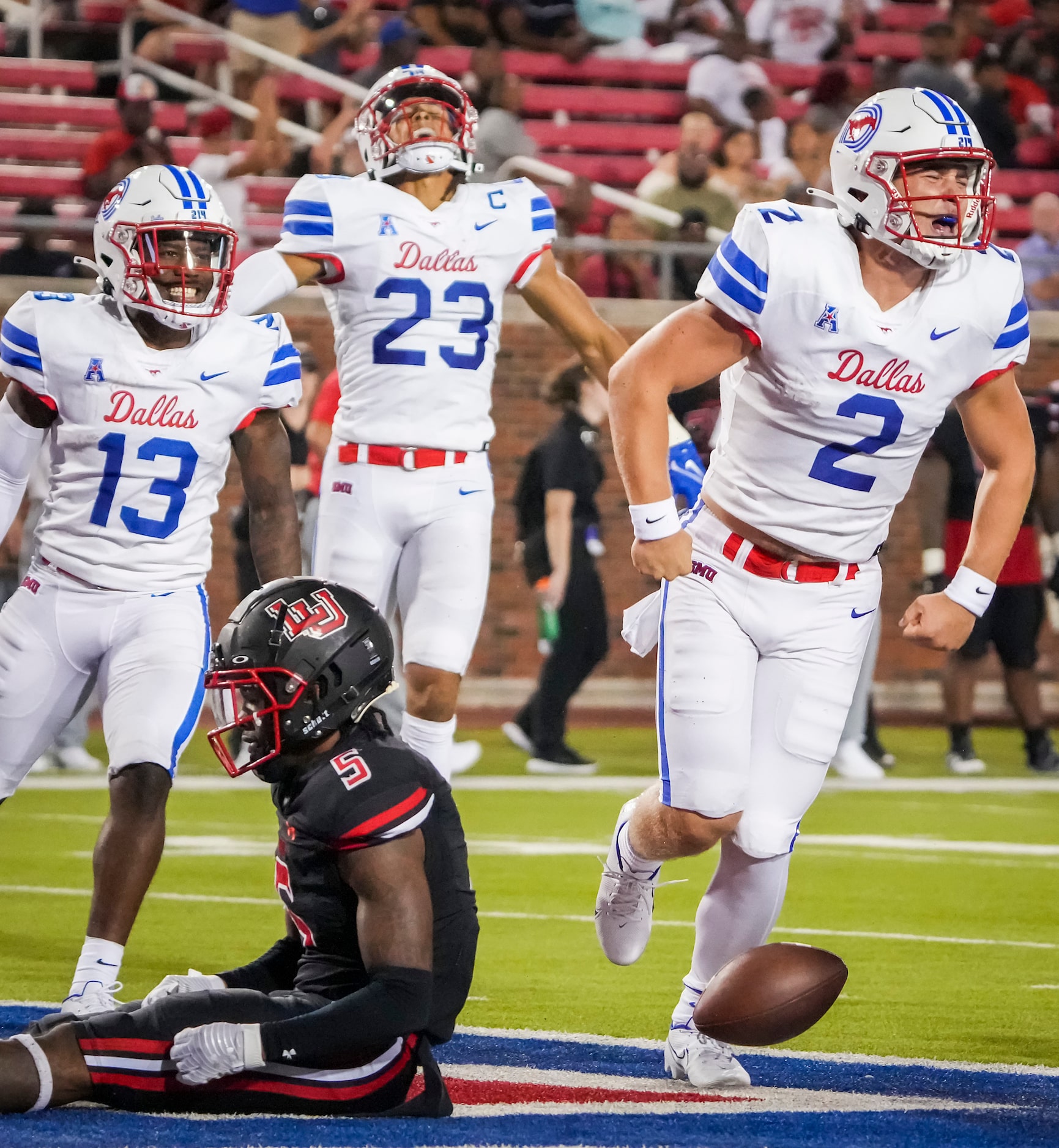 SMU quarterback Preston Stone (2) celebrates after scoring on an 8-yard touchdown run past...