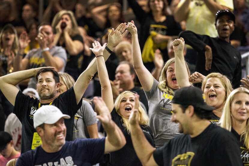 Fans react after Frisco Memorial scores a touchdown against Frisco Lebanon Trail in Frisco...