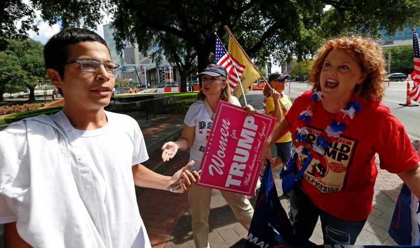 Trump supporter Kimberly Loyd of McKinney (right) argued with Anthony Saenz of Dallas, a...