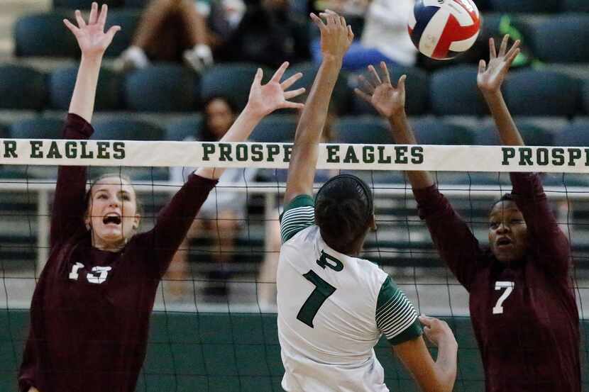 Prosper's Bailey Birmingham (7) attempts to hit between Plano's Sophie Robinson (13) and...