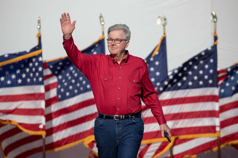 Texas Lt. Gov. Dan Patrick waves to the crowd during a rally featuring former President...