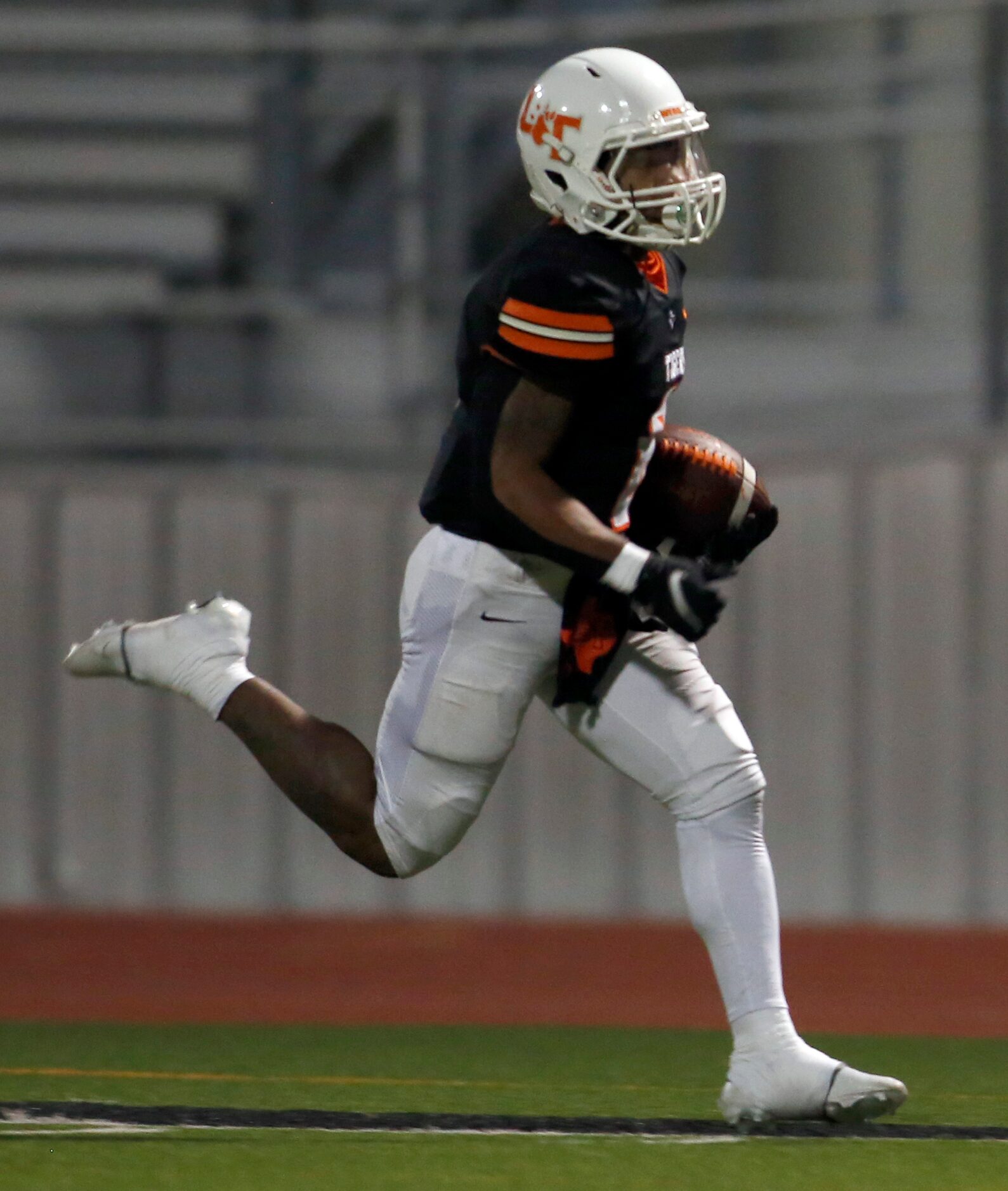 Lancaster running back DQ James (6) sprints to the end zone for a long rushing touchdown...