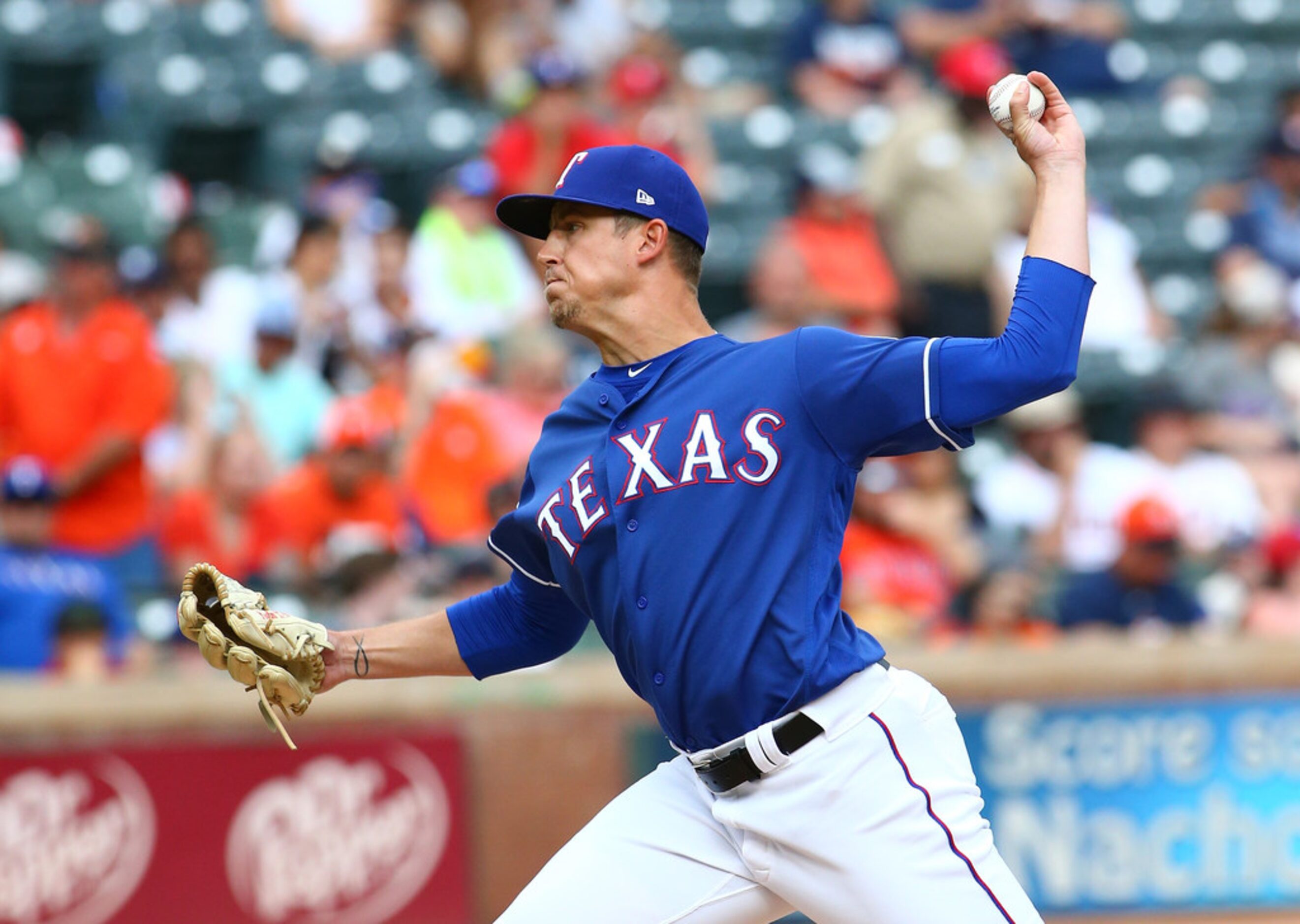 ARLINGTON, TX - JULY 14: Kyle Bird #55 of the Texas Rangers warms up in the seventh inning...