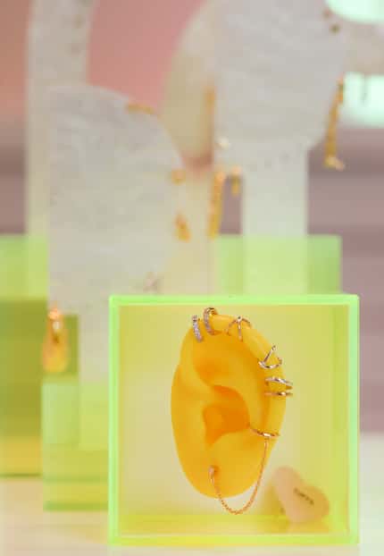A rubber ear displays cuff earrings available at Studs in West Village.