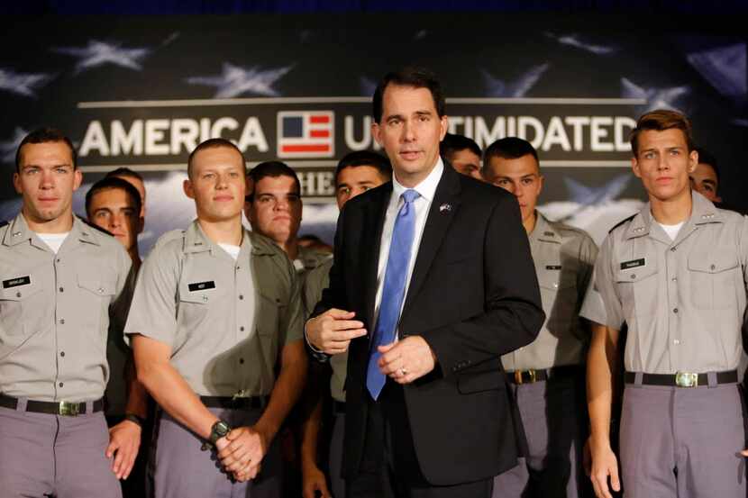  Republican presidential candidate, Wisconsin Gov. Scott Walker, stands with Citadel cadets...