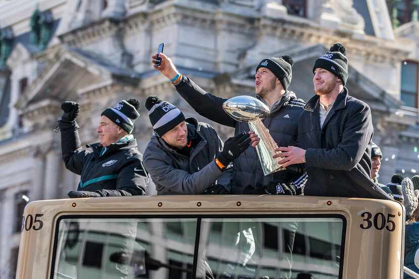 With City Hall in the background, the Philadelphia Eagles' Super Bowl MVP Nick Foles, left,...