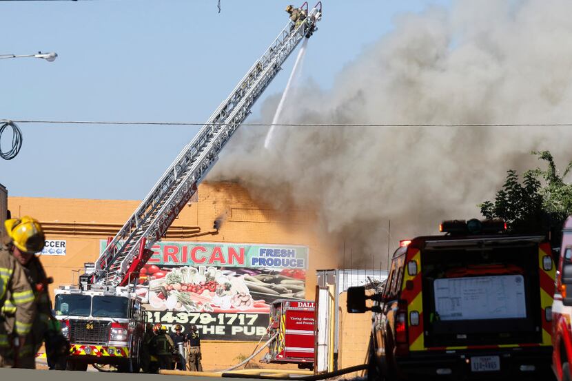 Dallas Fire-Rescue at a 4-alarm structure fire at American Fresh Produce, located at 2400...