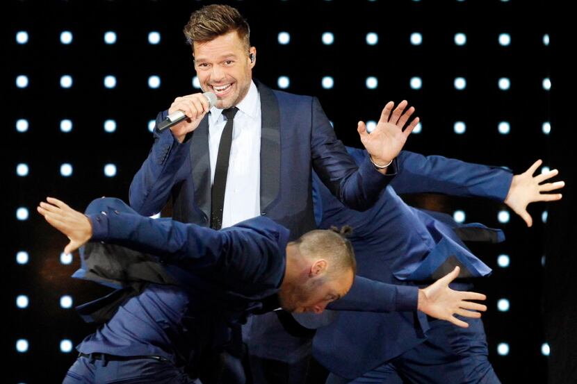 Ricky Martin mixes it up with his dancers on Sunday, Oct. 04, 2015, at Gexa Energy Pavilion...