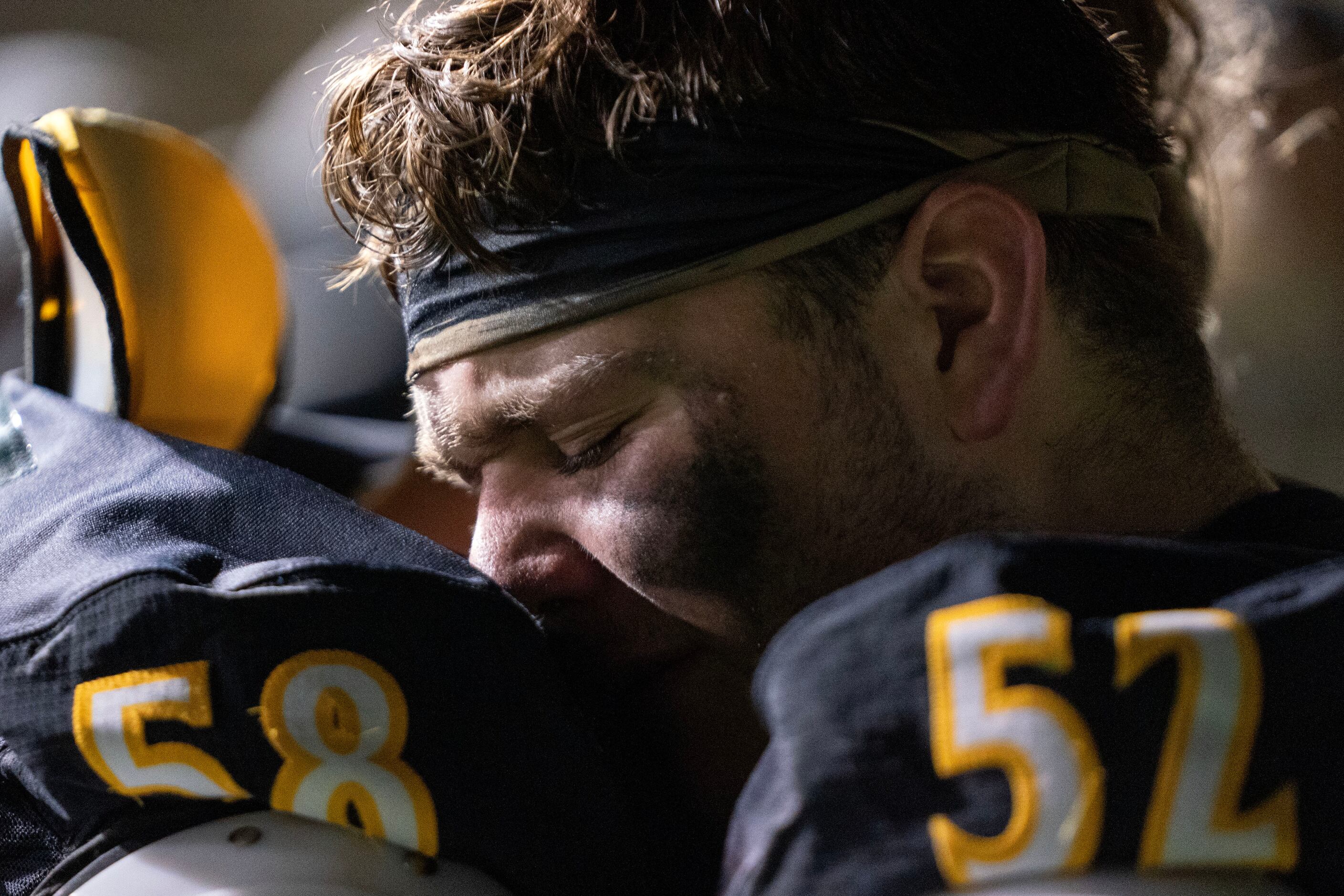 Crandall senior offensive lineman Tytus Daugherty (52) is comforted by junior offensive...