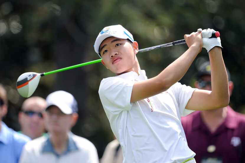 Apr 8, 2013; Augusta, GA, USA; Tianlang Guan, age 14, from China hits from the 15th tee...