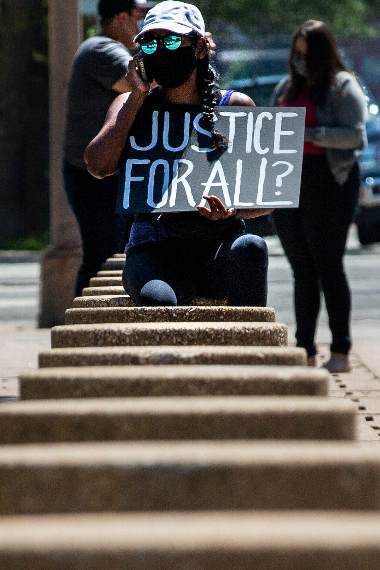 Shalini Maharaj joins protesters in a silent demonstration at Dallas City Hall to denounce...